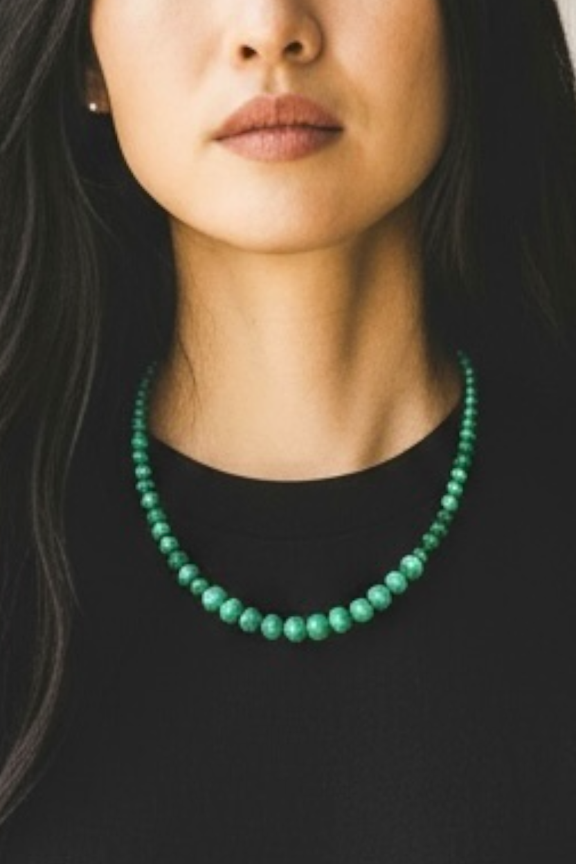 Graduated round malachite beads are highlighted with the smallest amount of sterling silver detailing and a sturdy hook clasp. Measurements: 47.2 cm length. Bead diameter 8mm, 6mm, 4mm and 3mm