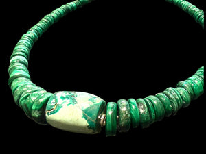 Unique choker of graduated heshi beads that showcase a stunning turquoise and malachite centrepiece. Sterling silver bead detailing and clasp. Length 40 cm