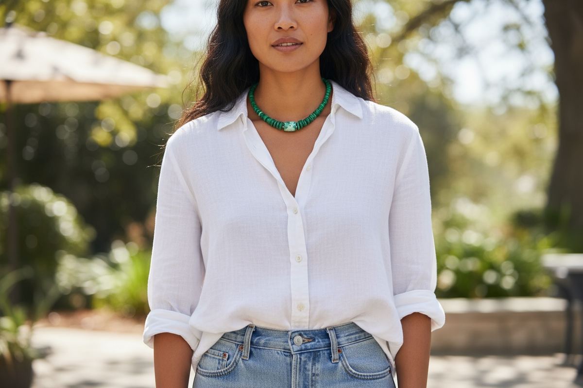 Unique choker of graduated heshi beads that showcase a stunning turquoise and malachite centrepiece. Sterling silver bead detailing and clasp. Length 40 cm