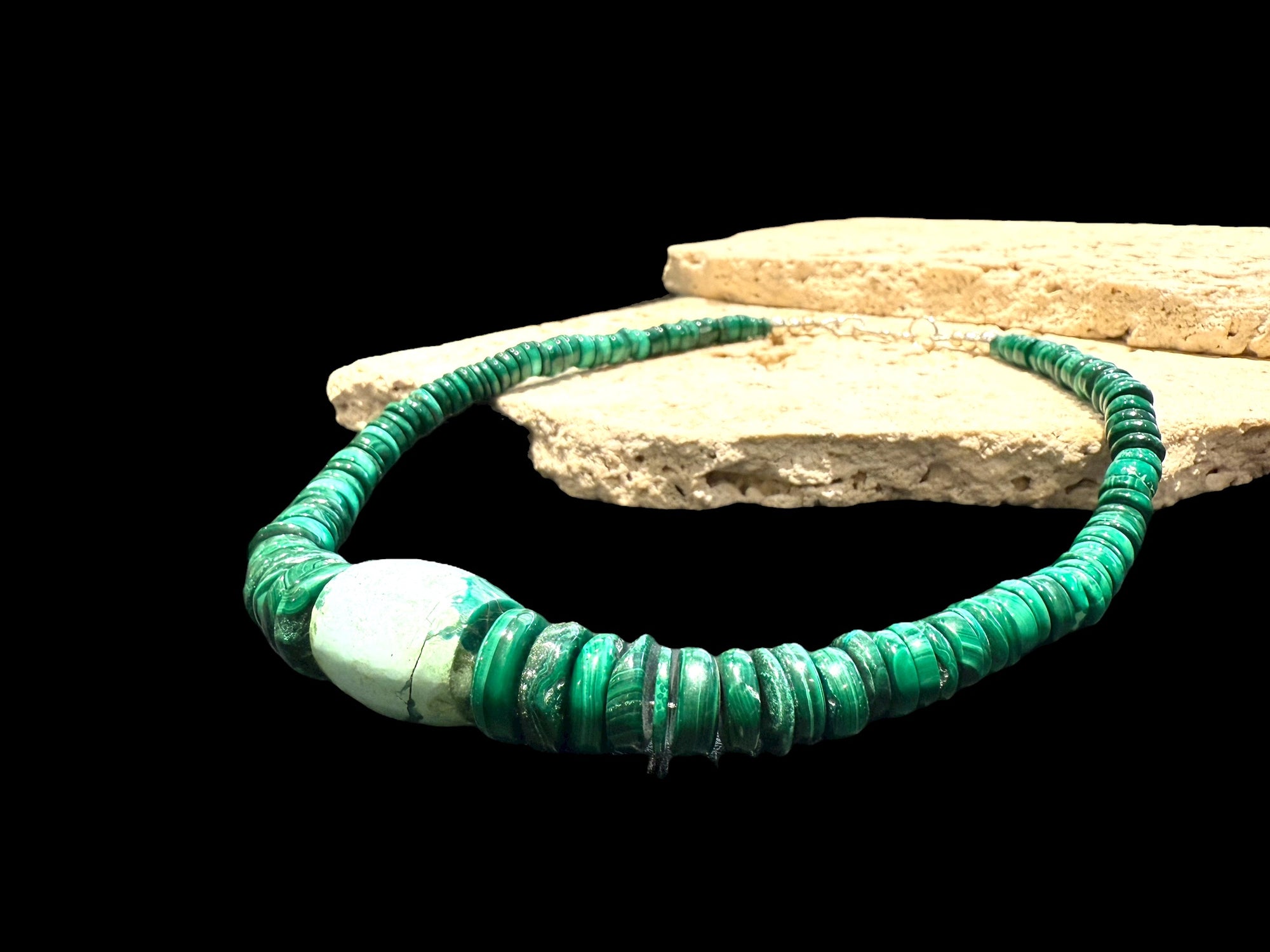 Unique choker of graduated heshi beads that showcase a stunning turquoise and malachite centrepiece. Sterling silver bead detailing and clasp. Length 40 cm