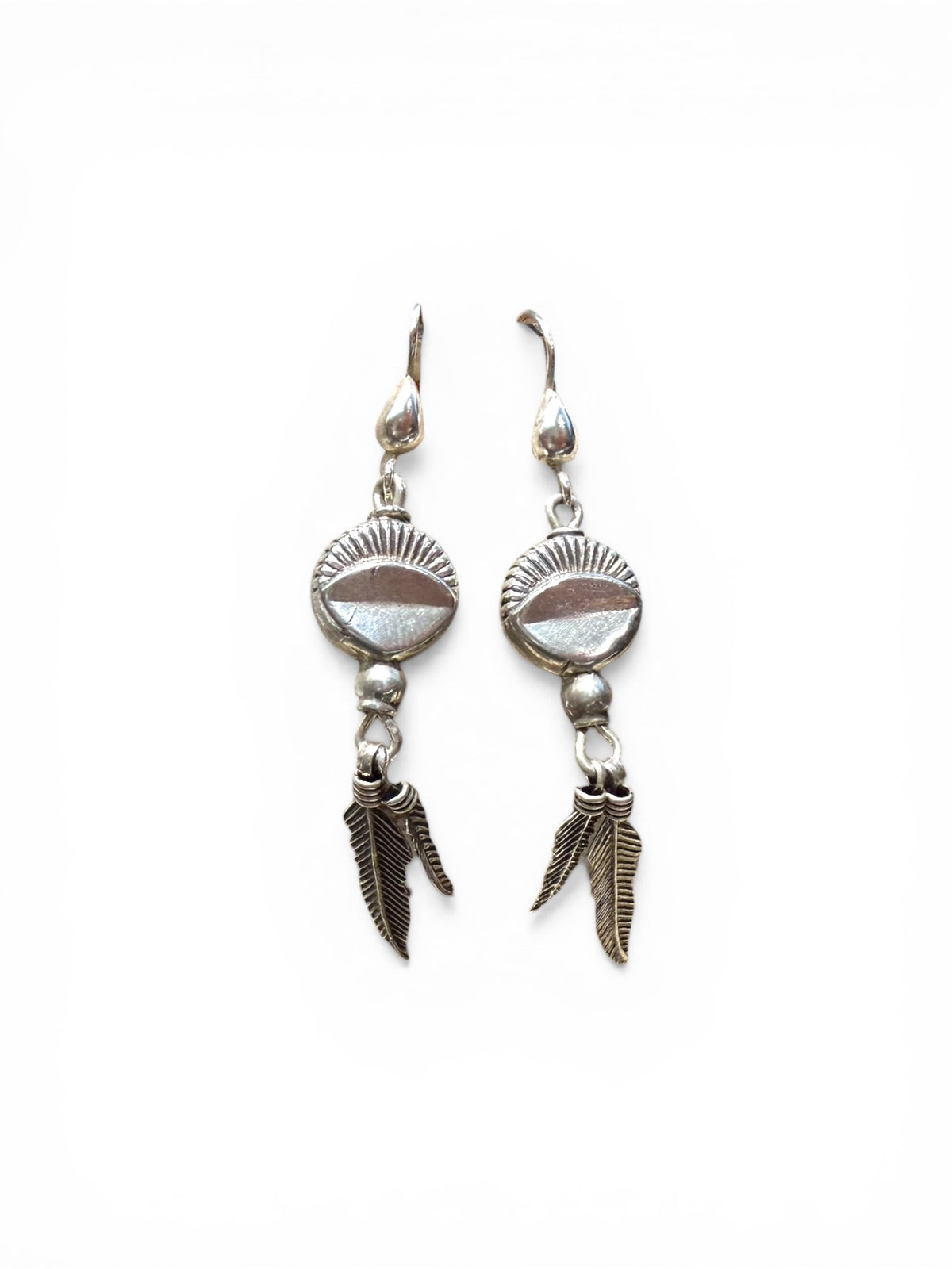 These medicine drum earrings have two feathers dangling below. The beads are vintage and all components including the hooks are sterling silver.&nbsp;

Measurements: length 6 cm