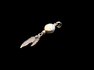 Medicine drum pendant with two feathers. The beads are vintage and all components are sterling silver. A unisex pendant. Length 5 cm