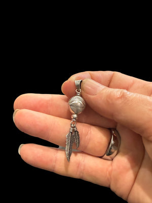 Medicine drum pendant with two feathers. The beads are vintage and all components are sterling silver. A unisex pendant. Length 5 cm