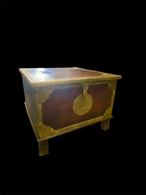 Hardwood coffee table chest with dual opening lid and brass decoration. This lovely and practical chest can be used as a side table, small coffee table or storage chest. It is stained brown-red and is finished with brass decoration. Both sides open. From Rajasthan, India. Measurements: 61 x 61 cm, height 46 cm.