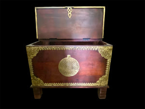 Hardwood coffee table chest with dual opening lid and brass decoration. This lovely and practical chest can be used as a side table, small coffee table or storage chest. It is stained brown-red and is finished with brass decoration. Both sides open. From Rajasthan, India. Measurements: 61 x 61 cm, height 46 cm.