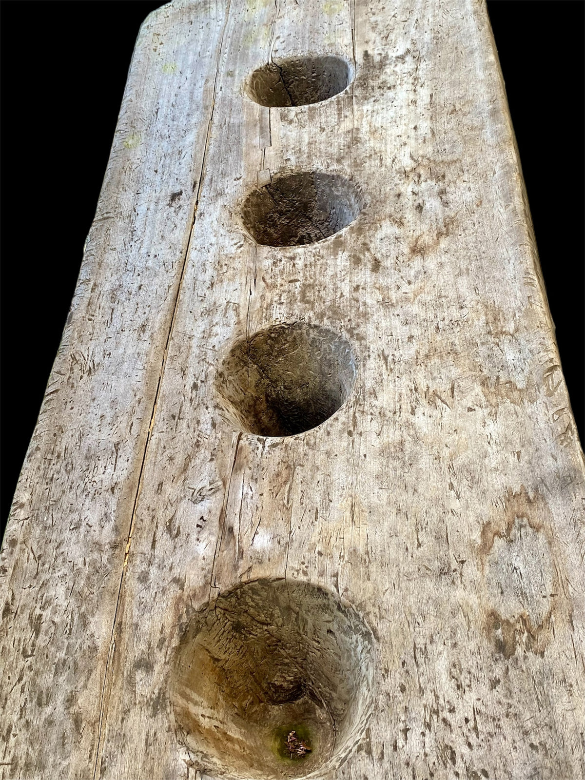 Naga pounding table. Hand-carved from a single teak tree trunk. Late 19th or early 20th century. From Nagaland, India. Length 2.48 m