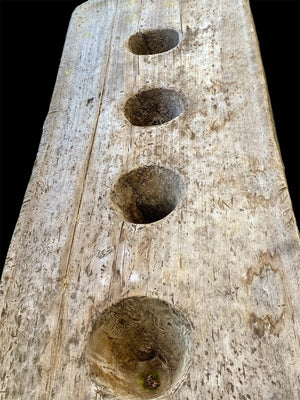 Naga pounding table. Hand-carved from a single teak tree trunk. Late 19th or early 20th century. From Nagaland, India. Length 2.48 m