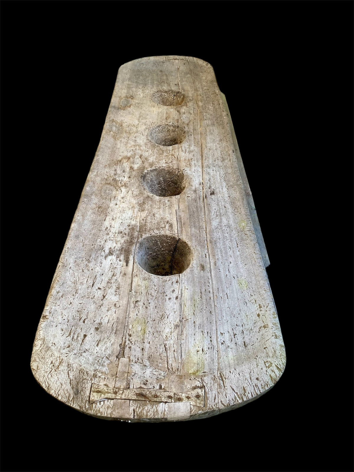 Naga pounding table. Hand-carved from a single teak tree trunk. Late 19th or early 20th century. From Nagaland, India. Length 2.48 m