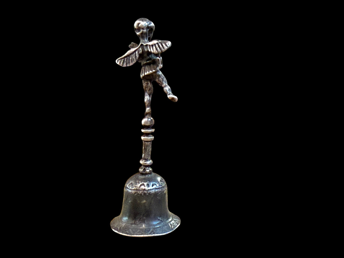 Small, decorative vintage bell with winged putto and dolphin. Sweet tone. Marked 800 ie 80% silver. From Italy. Height 6.4 cm. Diameter of bell's base 2.2 cm.