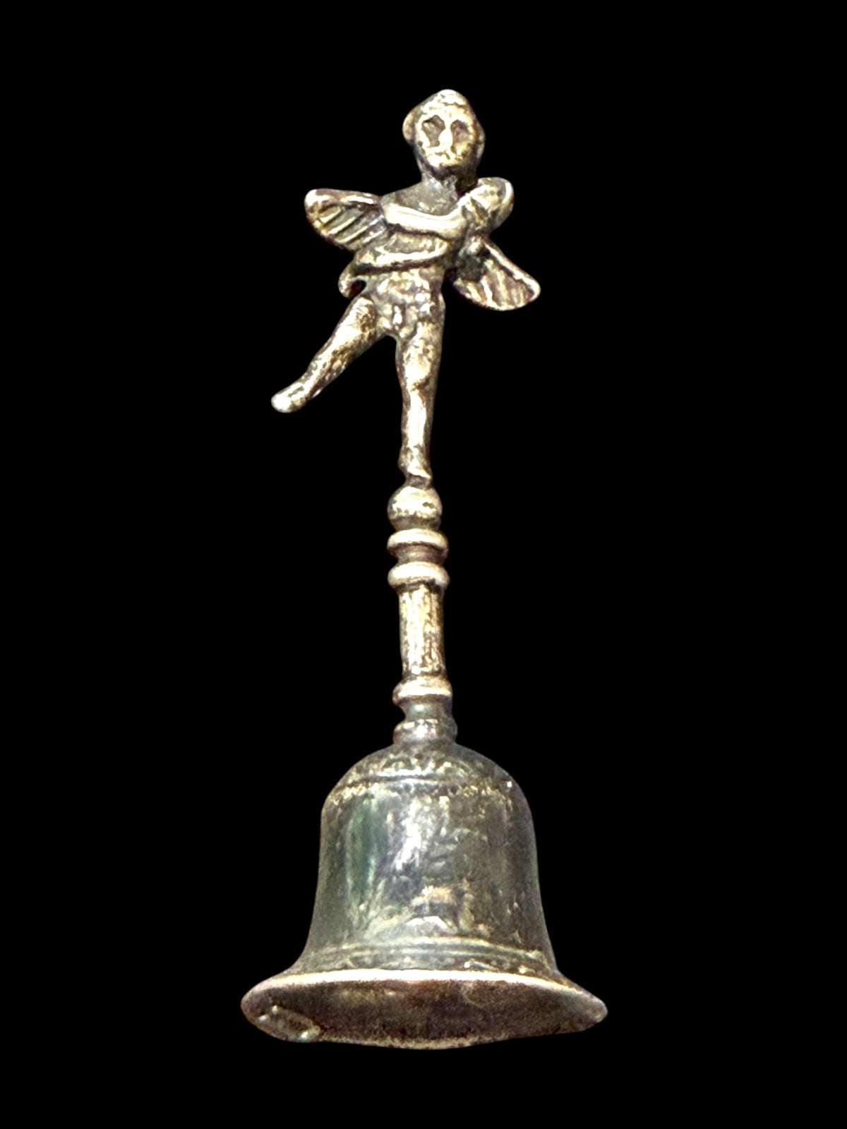 Small, decorative vintage bell with winged putto and dolphin. Sweet tone. Marked 800 ie 80% silver. From Italy. Height 6.4 cm. Diameter of bell's base 2.2 cm.