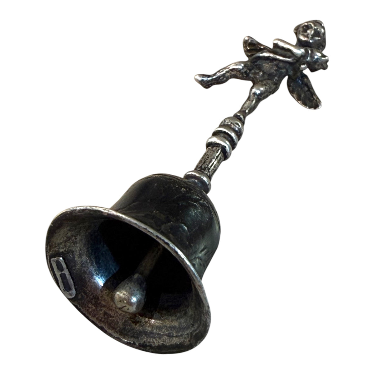 Small, decorative vintage bell with winged putto and dolphin. Sweet tone. Marked 800 ie 80% silver. From Italy. Height 6.4 cm. Diameter of bell's base 2.2 cm.