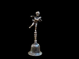 Small, decorative vintage bell with winged putto and dolphin. Sweet tone. Marked 800 ie 80% silver. From Italy. Height 6.4 cm. Diameter of bell's base 2.2 cm.