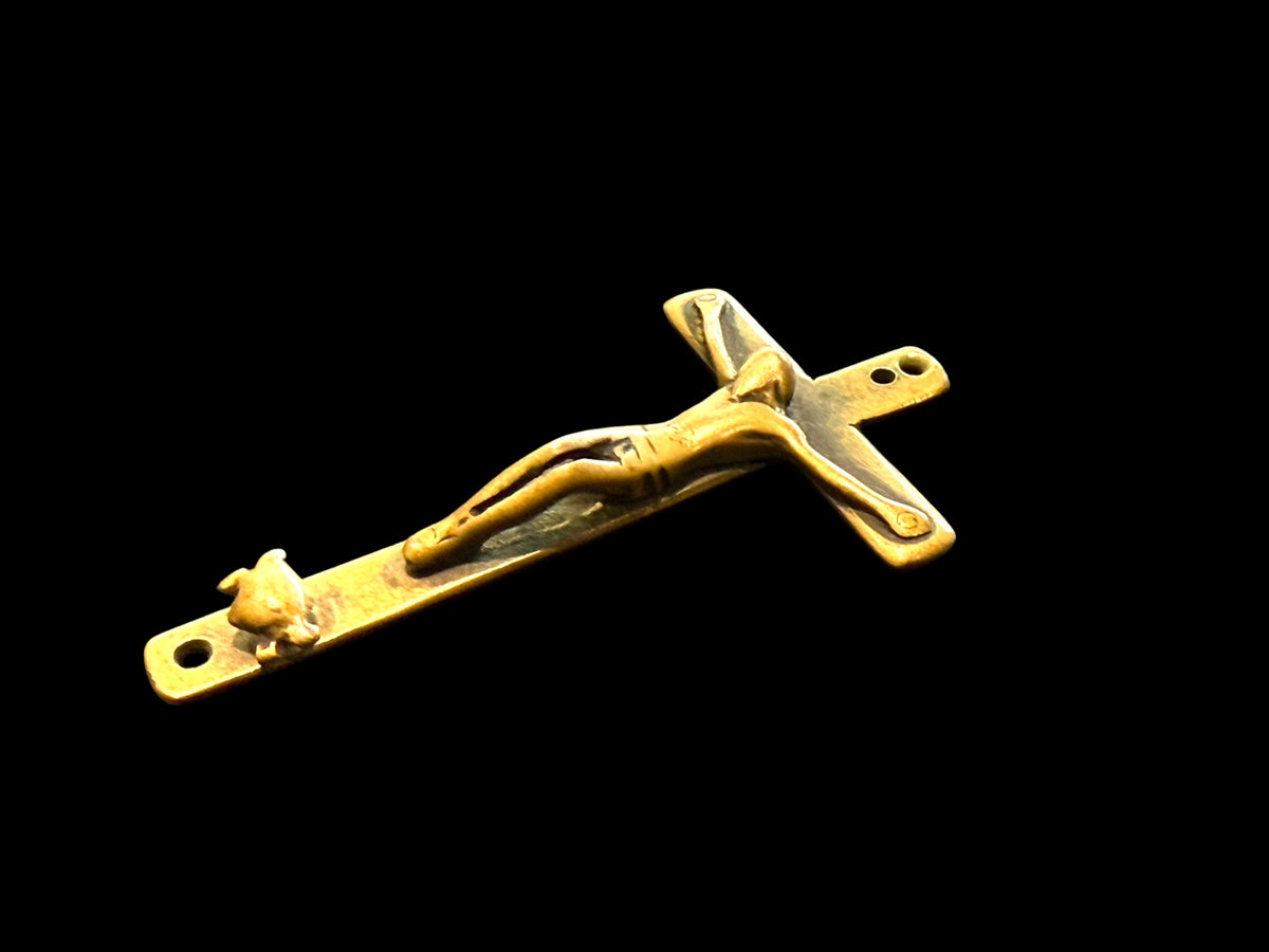 Late 19th C Italian crucifix. Brass, rubbed. Naples, Italy. Christ on cross with skull and crossbones below, representing Adam’s skull. H 6.6 cm, W 3.7 cm
