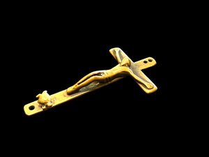 Late 19th C Italian crucifix. Brass, rubbed. Naples, Italy. Christ on cross with skull and crossbones below, representing Adam’s skull. H 6.6 cm, W 3.7 cm
