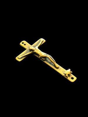 Late 19th C Italian crucifix. Brass, rubbed. Naples, Italy. Christ on cross with skull and crossbones below, representing Adam’s skull. H 6.6 cm, W 3.7 cm
