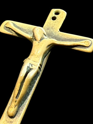 Late 19th C Italian crucifix. Brass, rubbed. Naples, Italy. Christ on cross with skull and crossbones below, representing Adam’s skull. H 6.6 cm, W 3.7 cm
