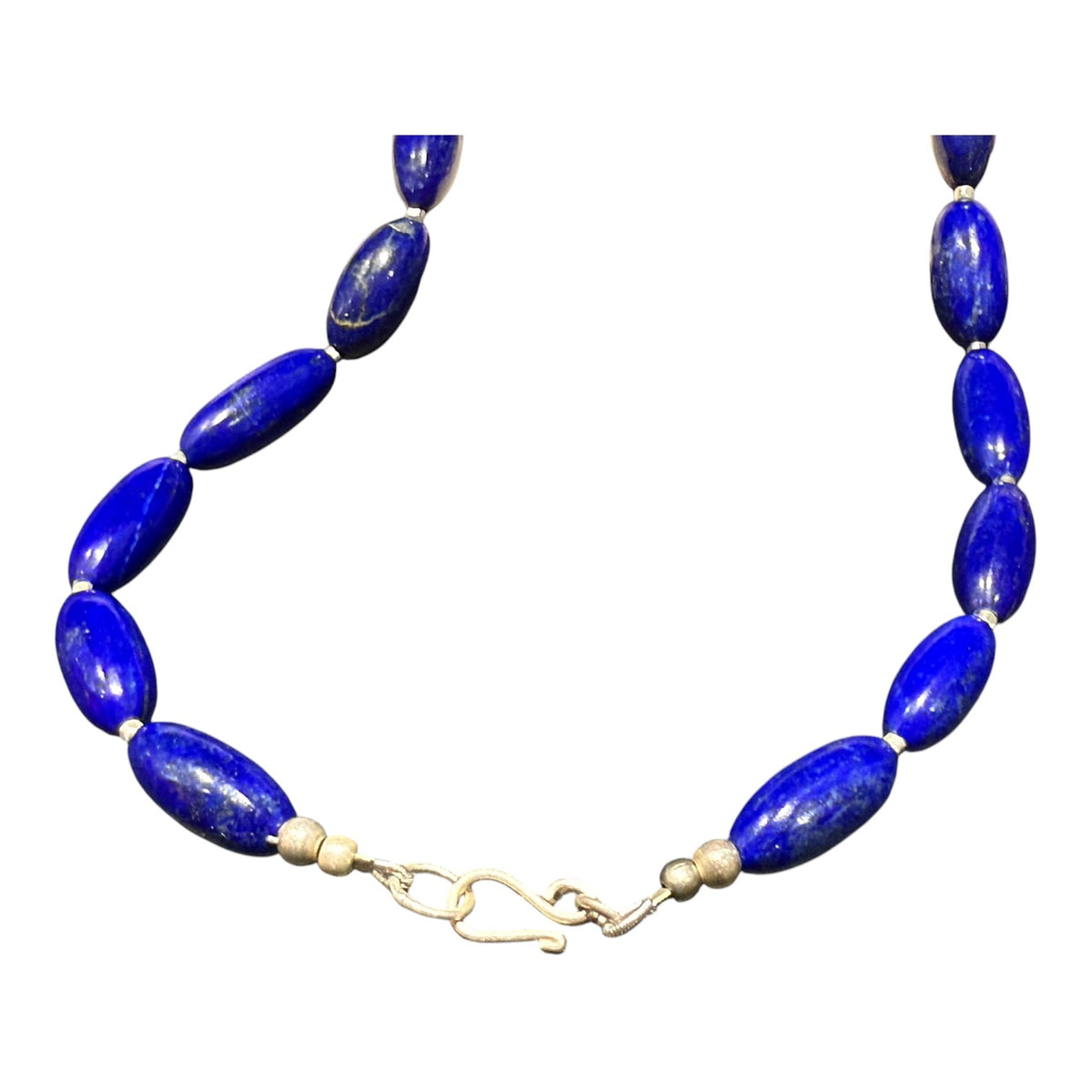 Simple and elegant, our short necklace is made from deep blue Afghan lapis lazuli and sterling silver, with a sterling silver clasp. Length 41.5 cm.