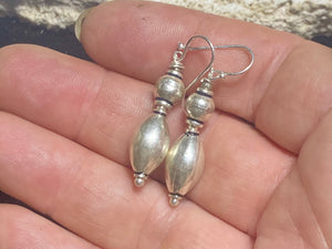 An elegant little pair of earrings. Sterling silver, featuring simple handmade Indian beads with silver hooks. Light and easy to wear, and a very classic earring. Measurements: 3.8 cm length including hook