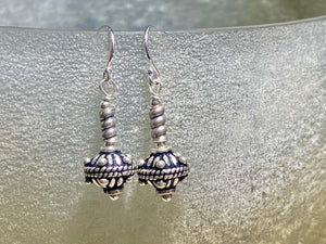 Sterling silver earrings featuring intricate, handmade tribal beads and silver hooks. Light and easy to wear, but these little earrings will make an impact. Length 3 cm including hook