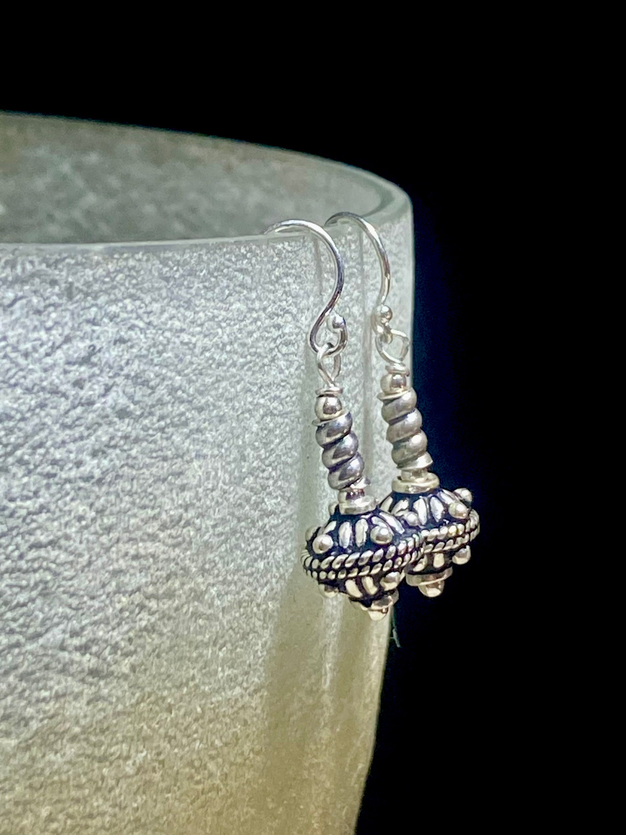 Sterling silver earrings featuring intricate, handmade tribal beads and silver hooks. Light and easy to wear, but these little earrings will make an impact. Length 3 cm including hook