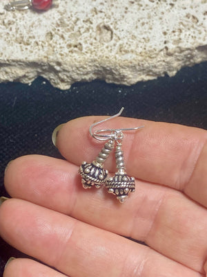 Sterling silver earrings featuring intricate, handmade tribal beads and silver hooks. Light and easy to wear, but these little earrings will make an impact. Length 3 cm including hook