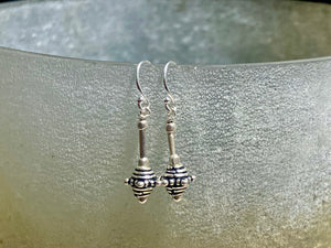 Sterling silver earrings featuring intricate, handmade tribal beads and silver hooks. Light and easy to wear, but these little earrings will make an impact. Length 2.8 cm including hook