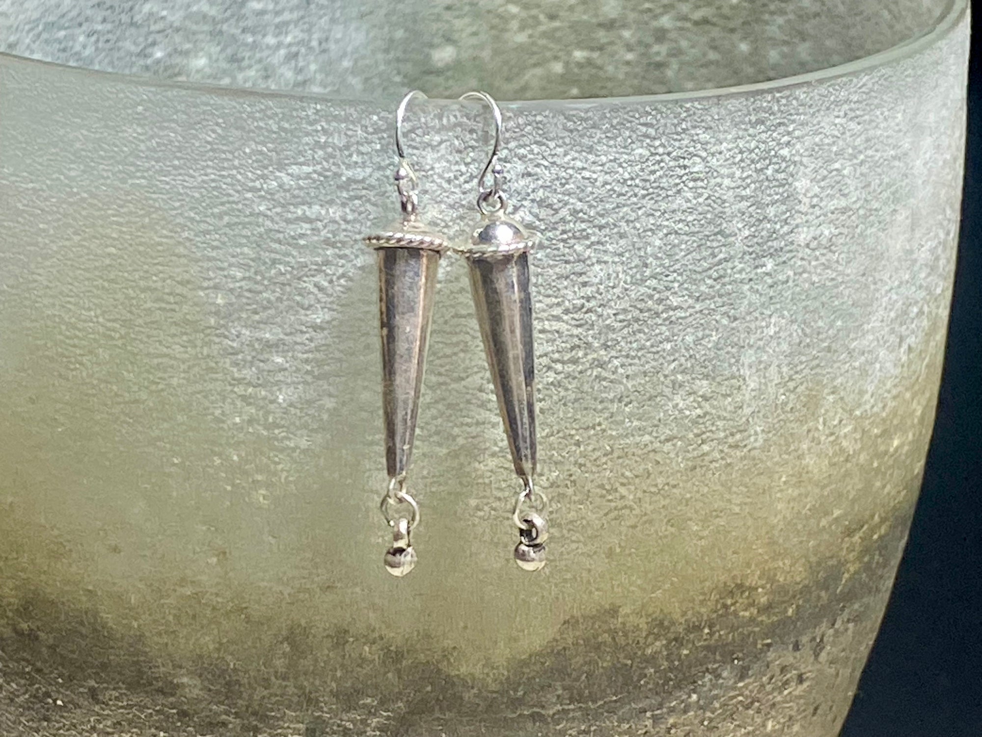 A simple earring featuring a hand cast Indian sterling silver beads with small dangle and silver hooks. &nbsp;Light and easy to wear, and a classic style of earring.

Measurements: 4.5 cm length including hook