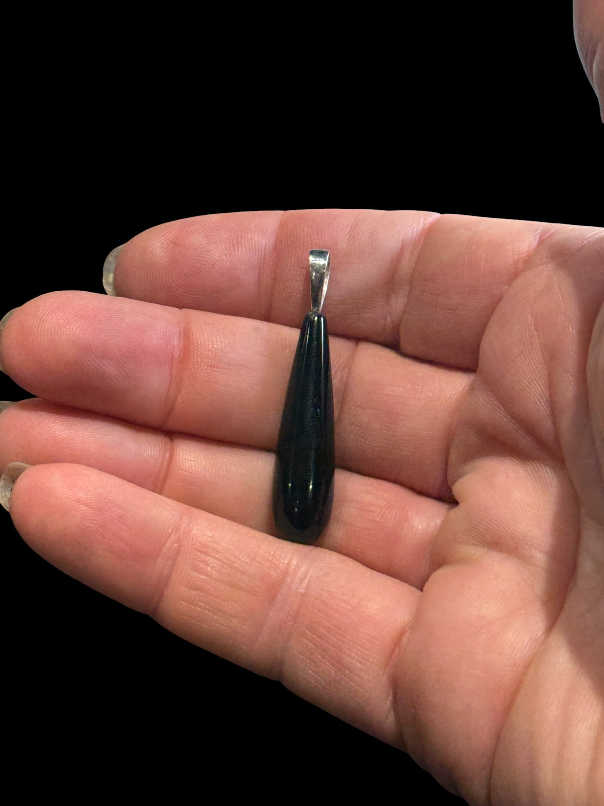 Simple, elegant pure black polished Mexican onyx teardrop pendant finished with a sterling silver bail. Length including bail 4 cm
