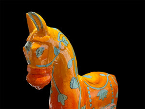 Bright and beautiful, our large horse statue is carved from solid hard wood and painted in burn orange with blue detail. A modern piece for all horse lovers, hand made in Rajasthan, India.

Measurements: height to ear 33 cm, length 24 cm, width 8 cm.