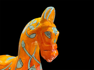 Bright and beautiful, our large horse statue is carved from solid hard wood and painted in burn orange with blue detail. A modern piece for all horse lovers, hand made in Rajasthan, India.

Measurements: height to ear 33 cm, length 24 cm, width 8 cm.