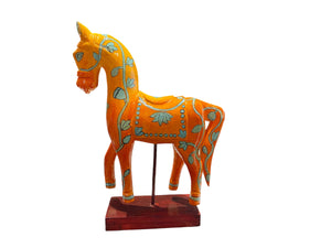 Bright and beautiful, our large horse statue is carved from solid hard wood and painted in burn orange with blue detail. A modern piece for all horse lovers, hand made in Rajasthan, India.

Measurements: height to ear 33 cm, length 24 cm, width 8 cm.