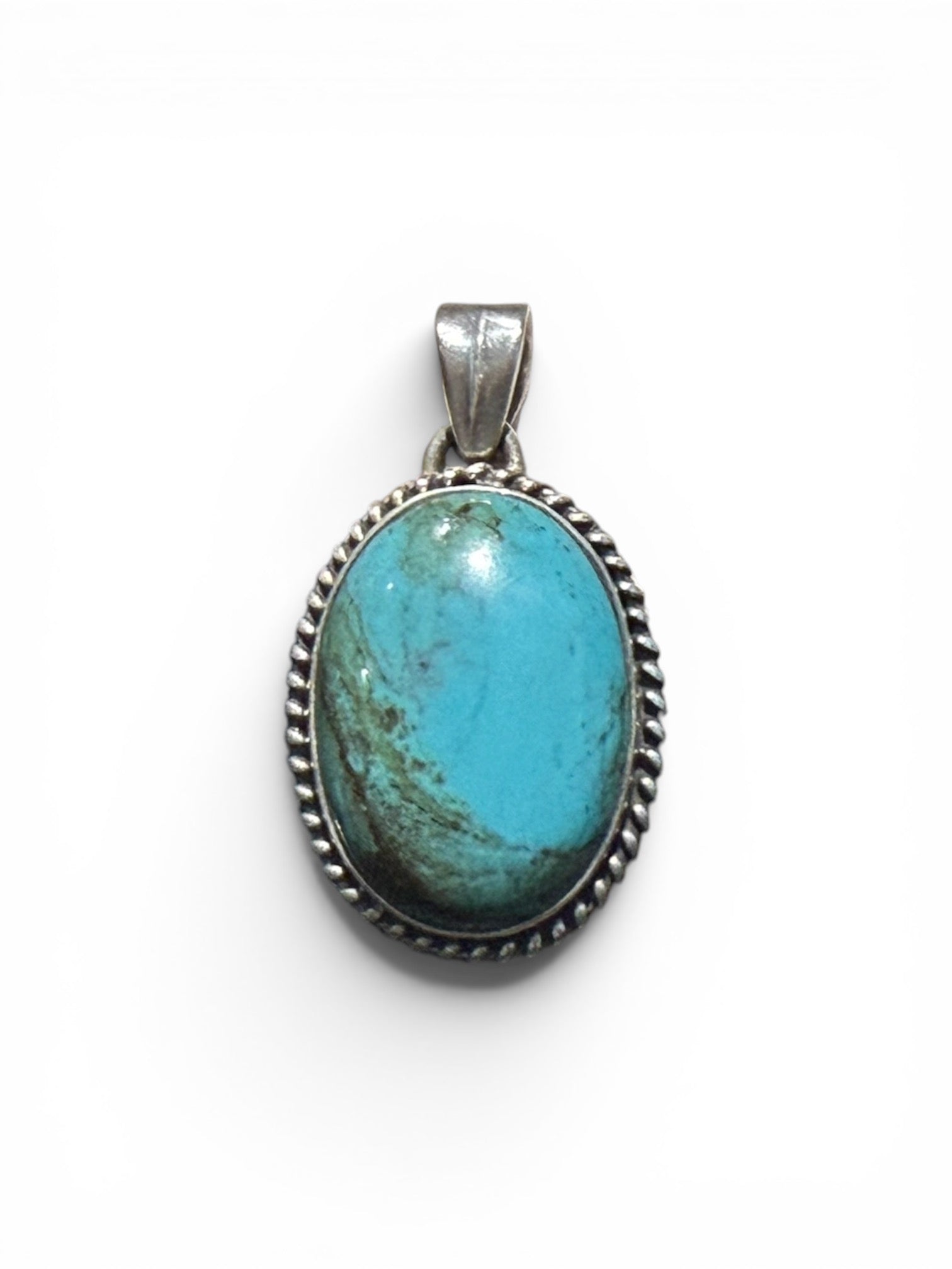 Large oval turquoise pendant is set off by a twist-rope sterling silver bezel, Measurements: 4 cm height including bail