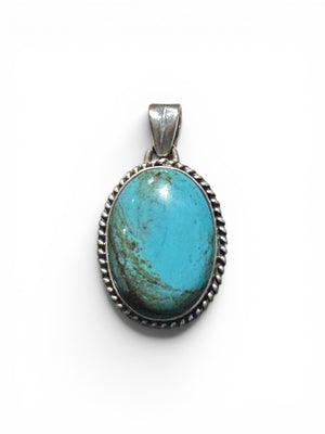 Large oval turquoise pendant is set off by a twist-rope sterling silver bezel, Measurements: 4 cm height including bail