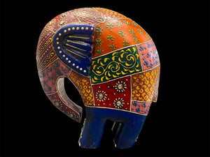 Our cutest elephant statue. Hand carved from solid hard wood, these elephants are full of character, are crafted in Rajasthan, India, and painted in intricate embossed detail. measurements: height 1 cm, length 15 cm, depth 6 cm