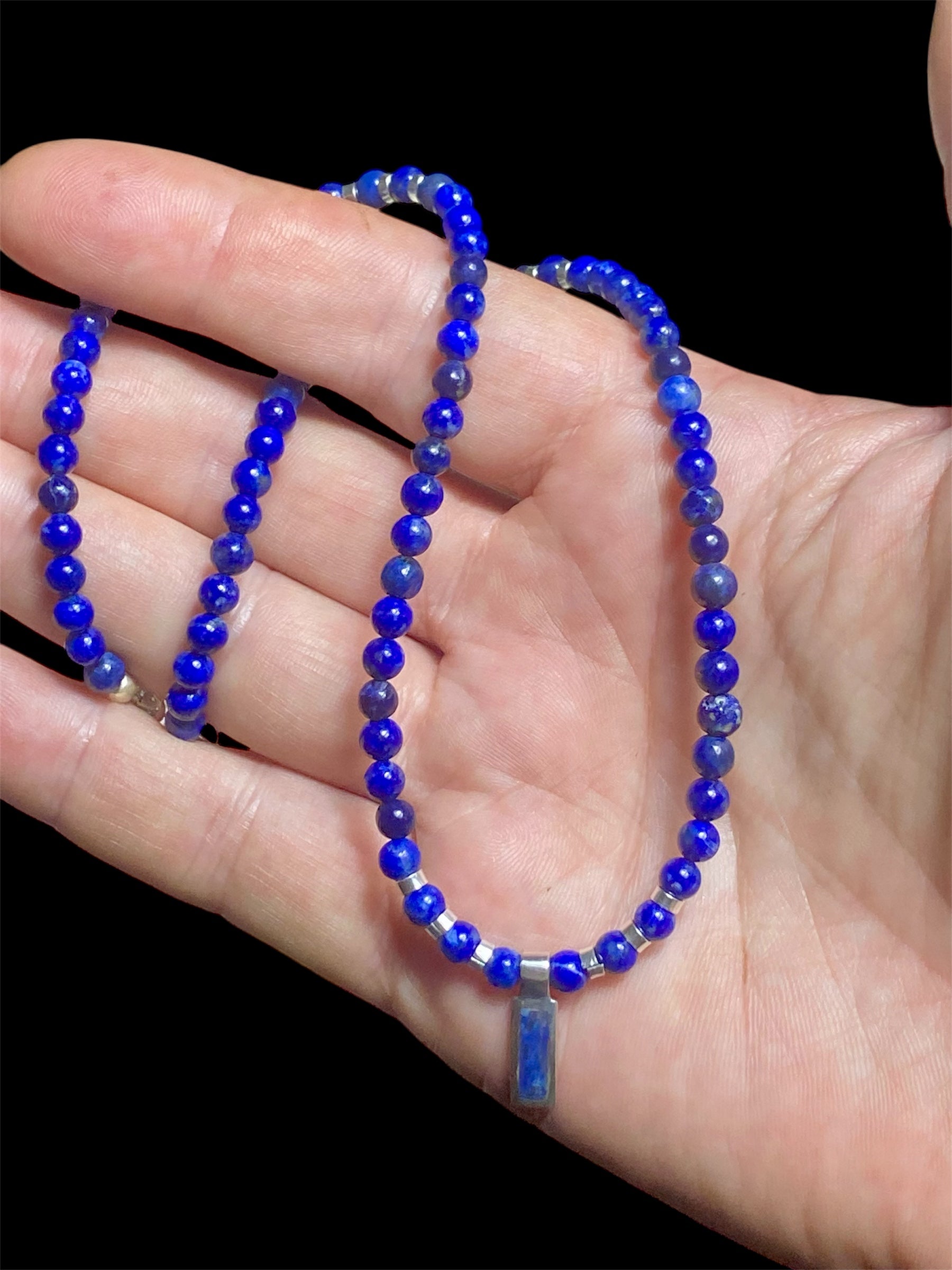 Simple & stylish short necklace of Afghan lapis with a silver and lapis pendant, highlighted with silver beads and a sterling silver parrot clasp. Length 41 cm