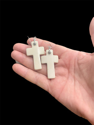 Stylish cross earrings with a southwest vibe. Hand carved cow bone, sterling silver detailing and hooks. Light and easy to wear. Drop including hook 6.5 cm