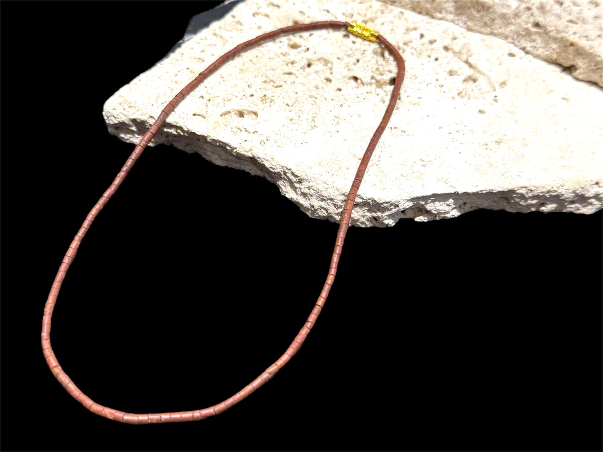 Natural serpentine bead necklace in a mat red-brown colour. Brass metal screw clasp. Measurements: 39 cm length, tube beads 2 mm diameter