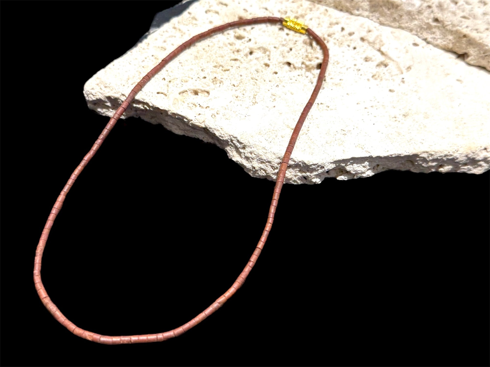 Natural serpentine bead necklace in a mat red-brown colour. Brass metal screw clasp. Measurements: 39 cm length, tube beads 2 mm diameter