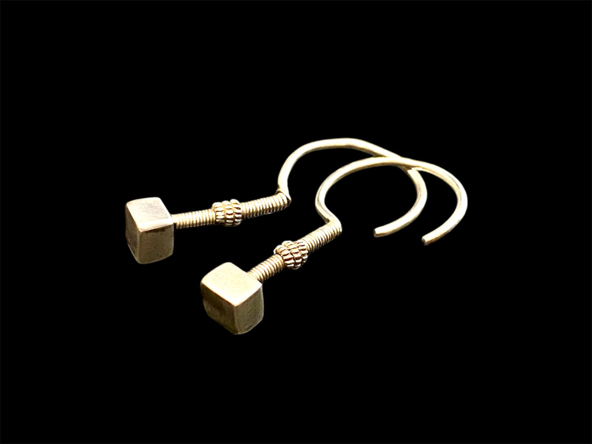 Rabari tribal earrings. High grade silver. Early 20th century. Traditionally worn in both the ear lobe and in the upper cartilage of the ear. Rabari, north east India. Measurements: length 4.5 cm, box pendant at end 0.6 x 1 0.5 cm