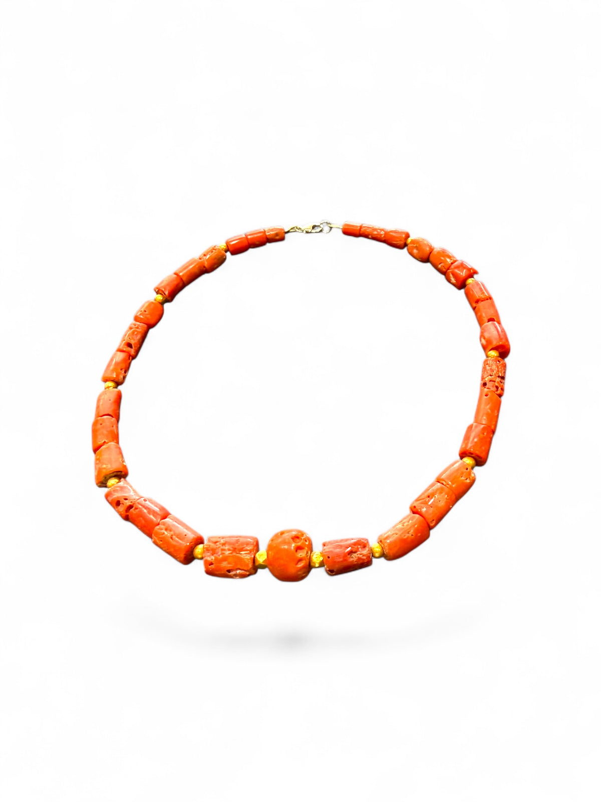 Graduated antique red coral from the Himalayas. The necklace features solid 22k gold bead highlights and a 9k gold clasp. Length 39.7 cm.