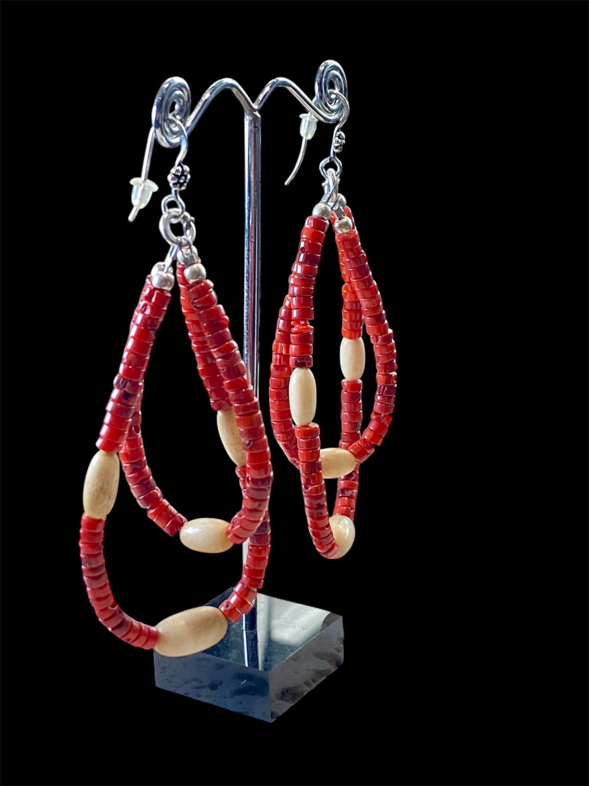 Long tribal earrings, two nested teardrop hoops of coral and buffalo bone beads, finished with sterling silver beads and hooks.  Total 9 cm length