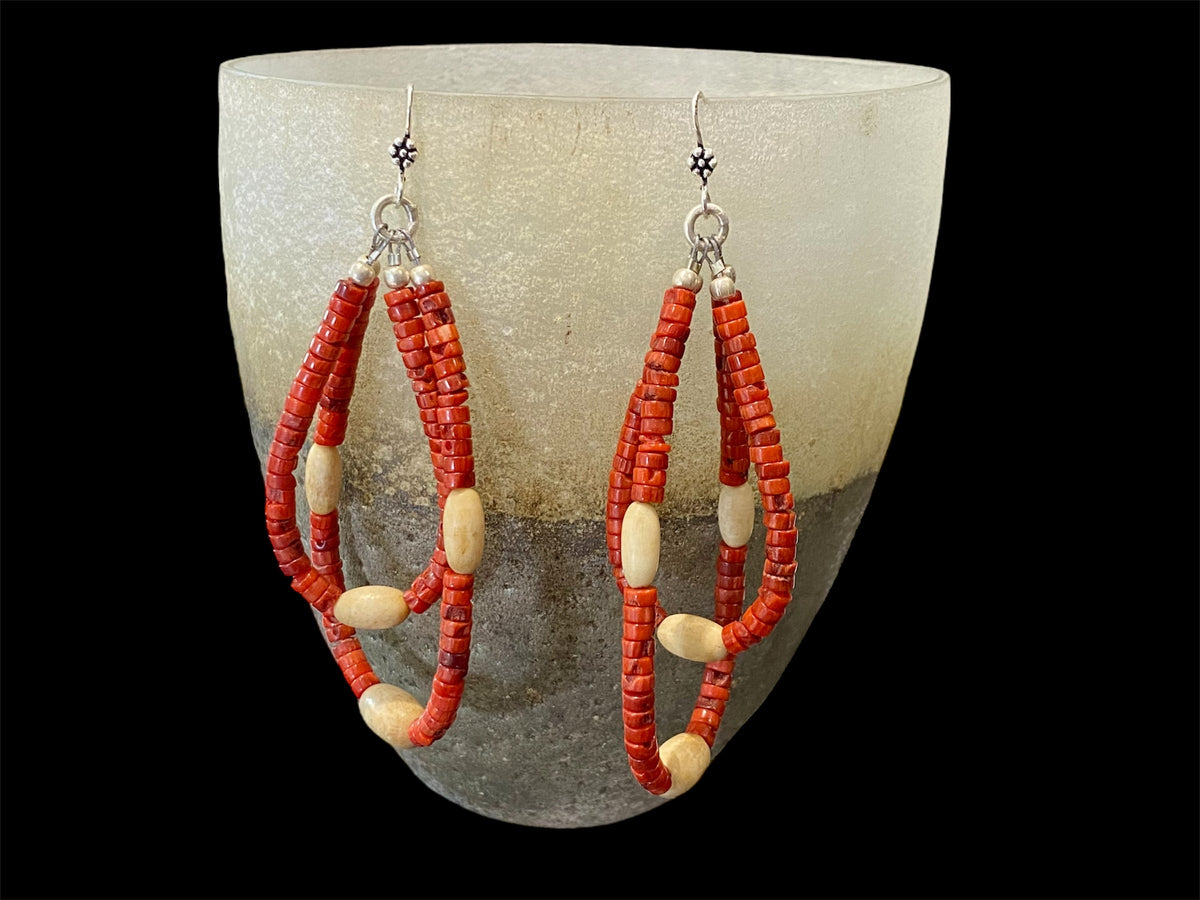 Long tribal earrings, two nested teardrop hoops of coral and buffalo bone beads, finished with sterling silver beads and hooks.  Total 9 cm length