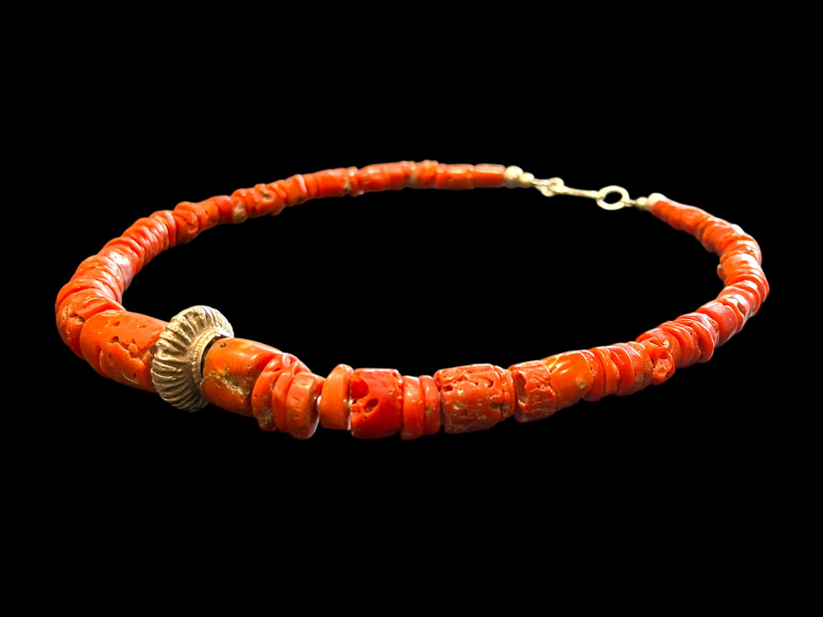 Necklace of graduated antique red coral from the Himalayas, finished with an antique silver bead and sterling silver clasp. Length 42.5 cm