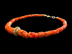 Necklace of graduated antique red coral from the Himalayas, finished with an antique silver bead and sterling silver clasp. Length 42.5 cm