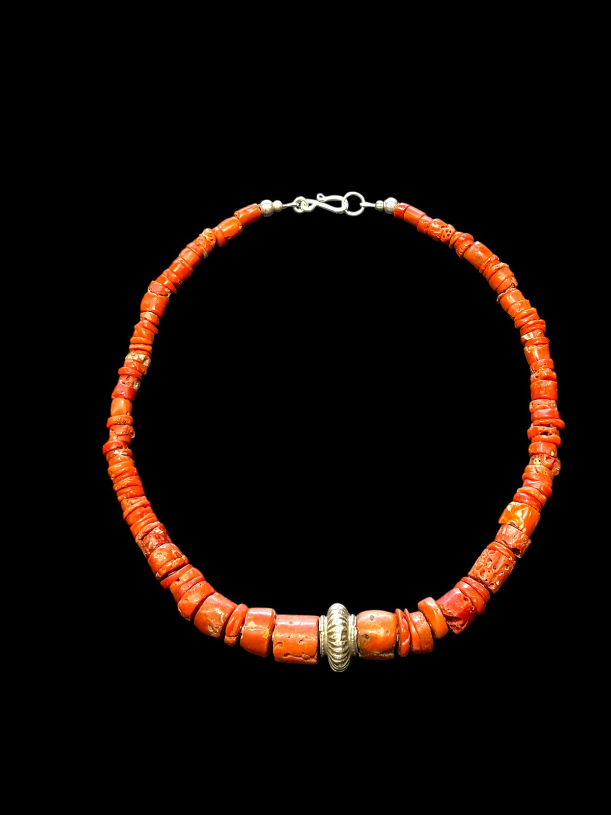 Necklace of graduated antique red coral from the Himalayas, finished with an antique silver bead and sterling silver clasp. Length 42.5 cm