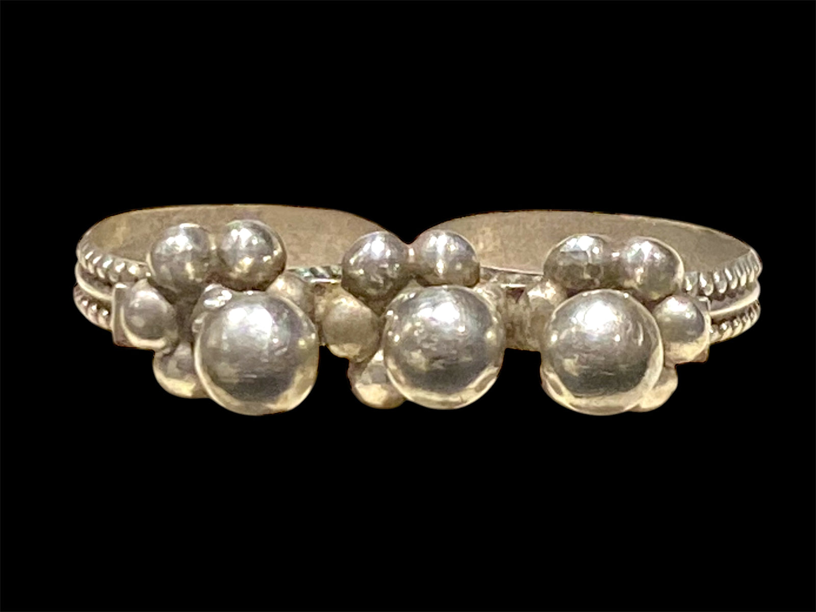 Rare double ring, Rabari, Gujarat region. High grade silver, early 20th century. A  very comfortable piece of jewellery, can be worn on the first two or second two fingers of the hand. Measurements: both rings approx 19 mm inside diameter, US size 9, No 20