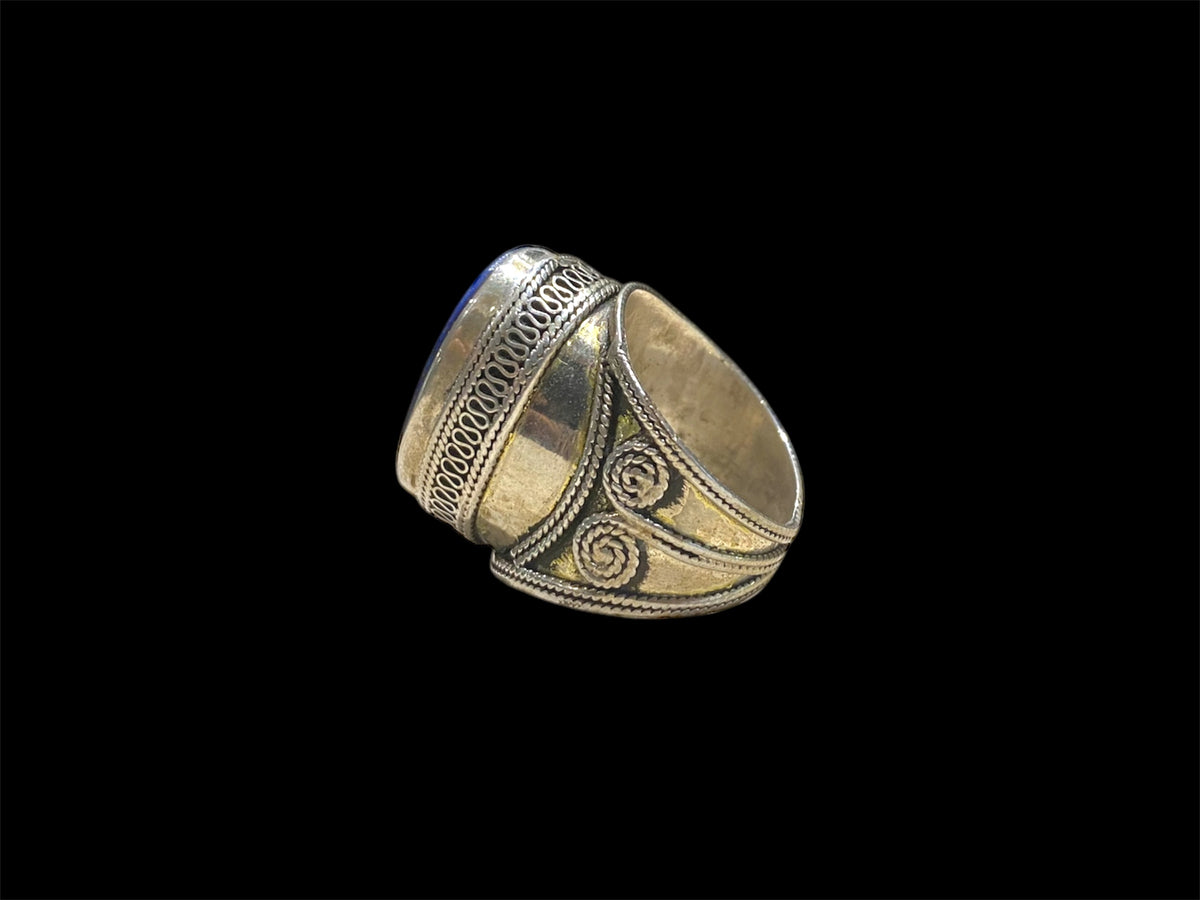 Turkoman ring features a lapis stone. Sterling silver with 24K gold wash. Turkmenistan. Measurements: Ring face 2.5 x 1.6 cm, Sizing: US Size 7.5 | 17.75 mm