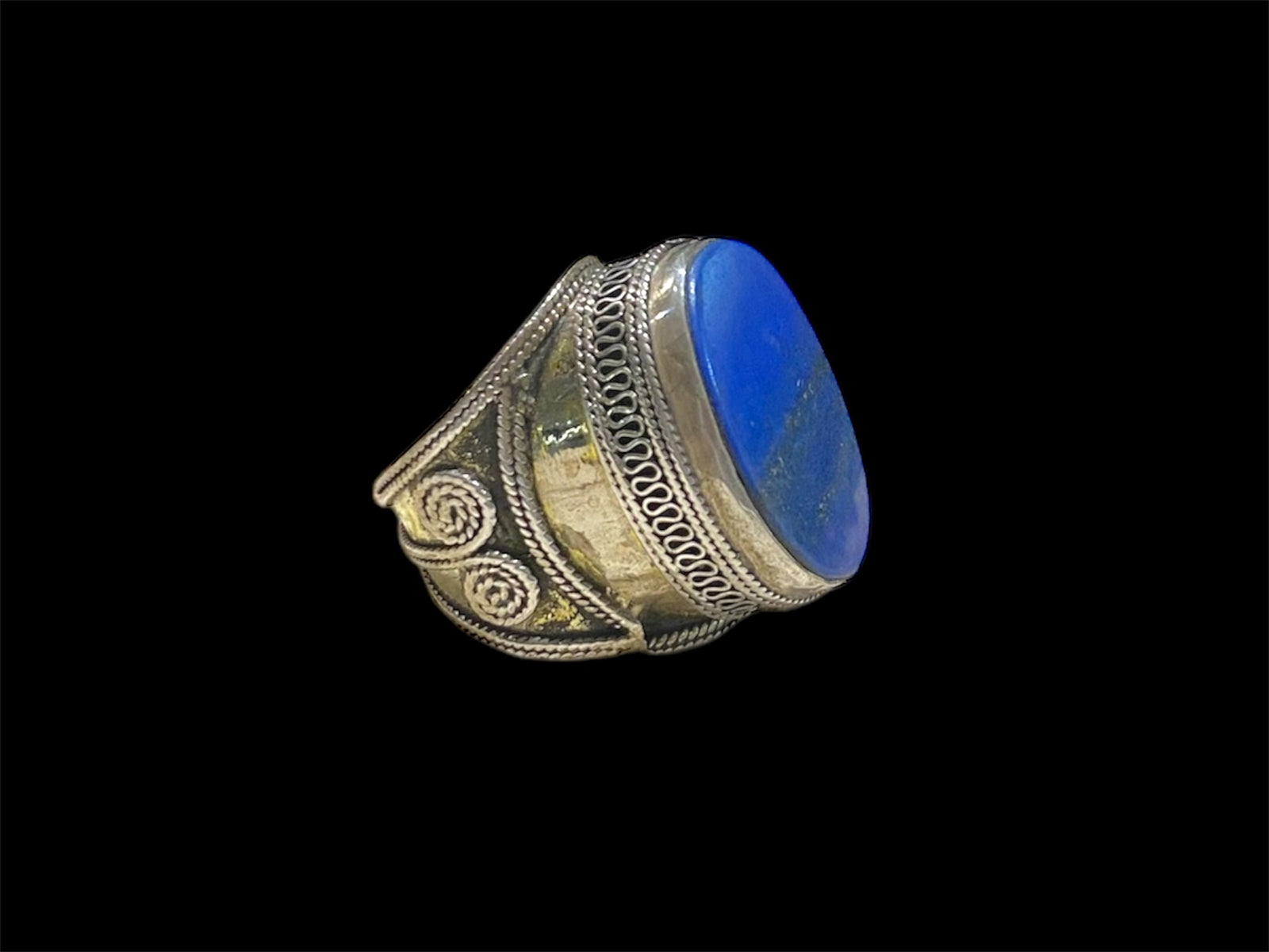 Turkoman ring features a lapis stone. Sterling silver with 24K gold wash. Turkmenistan. Measurements: Ring face 2.5 x 1.6 cm, Sizing: US Size 7.5 | 17.75 mm