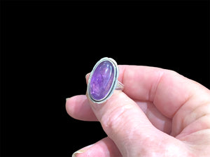 Elegant oval amethyst ring set in sterling silver. Open at the back to allow light to shine through, allowing the stone's natural beauty to shine through. Measurements: Face 2.4 x 1.4 cm Sizing: US Size 6 | 16.5 mm