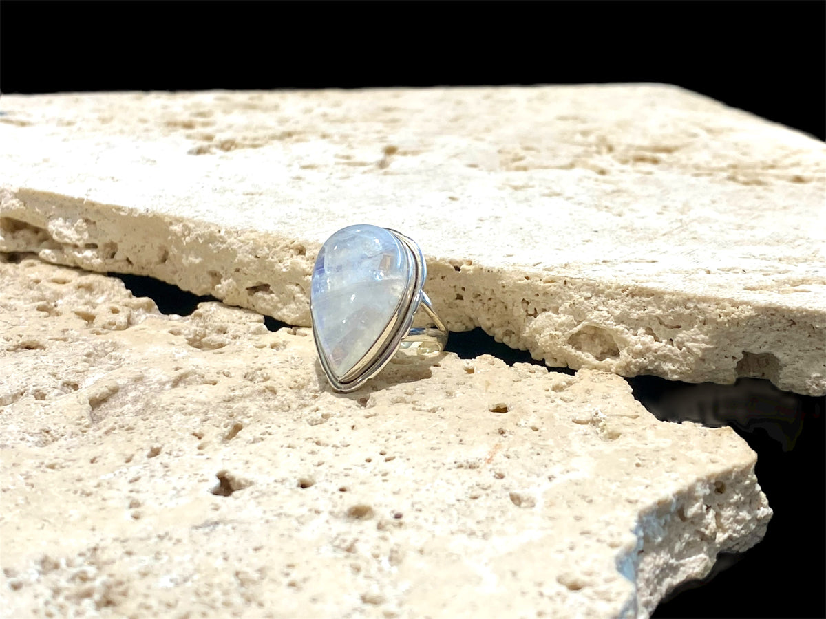 Teardrop rainbow moonstone ring set in sterling silver. Hand made in Jaipur, India. Measurements: Length of stone including bezel 2.5 cm (1 in), width 1.6 cm. Size 6 | 16.5 mm